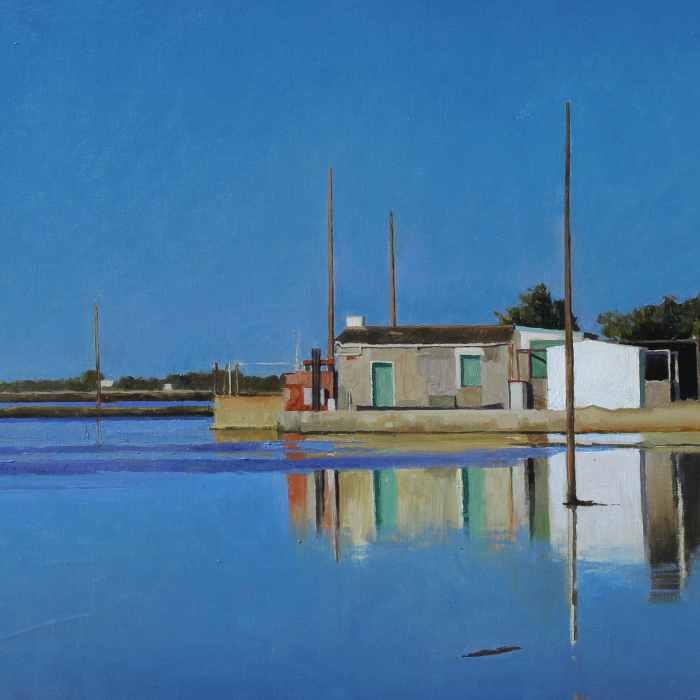 Oil on canvas painting of small, industrial structure at a marina's edge reflecting against the calm, blue water by Xavier Rodés titled Delta.