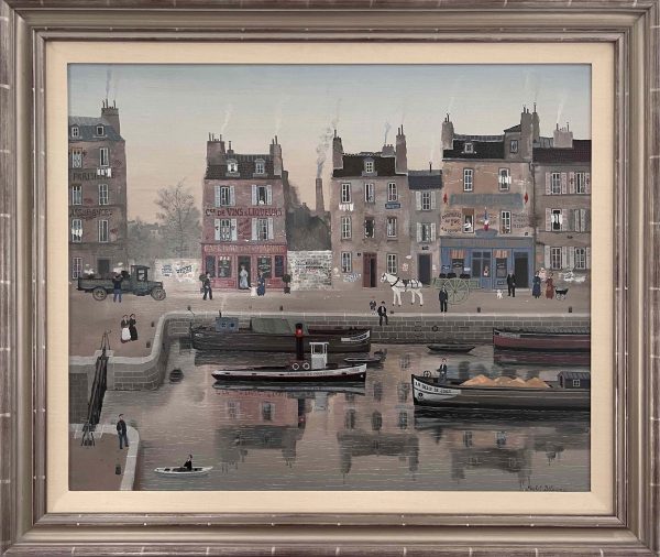 Oil on canvas painting of belle epoque Paris including storefronts, carriages, amblers, and boats on the Seine by Michel Delacroix titled "La Belle du Jour." In a silver frame.