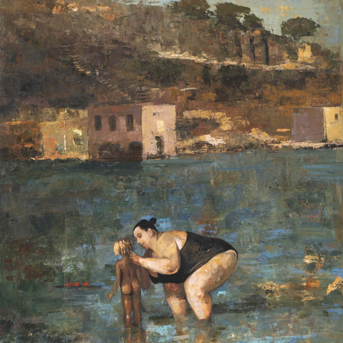 Oil and wax on canvas painting of a lady tending to a small, light-haired child in the shallows with classic Mediterranean houses and landscape in the background by Goxwa titled "Bathing."